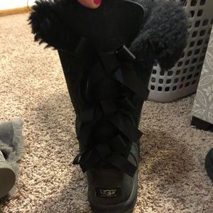 Tall Black UGGS with three bows in the back.